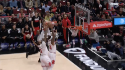 Torrey Craig and Andre Drummond both try to catch a pass off the backboard
